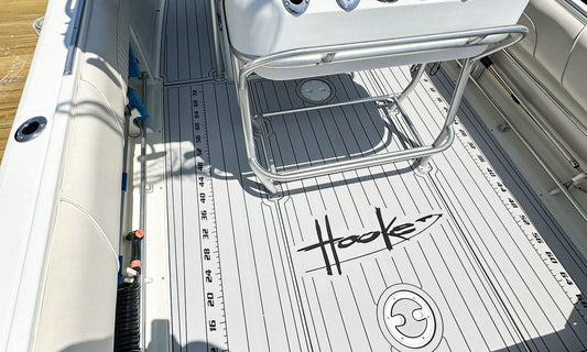 Custom AquaGrip EVA foam decking installed on a center console with a built-in fish ruler