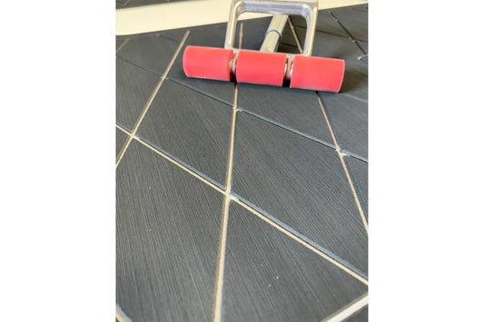 J-roller being used to install AquaGrip EVA foam boat flooring