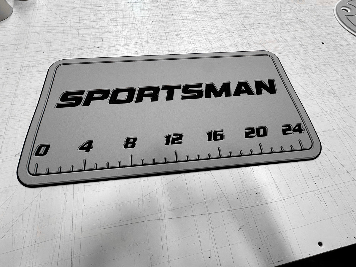 AquaGrip CT custom Sportsman laser-engraved cooler pad with fish ruler — medium gray over black — flat lay shop photo