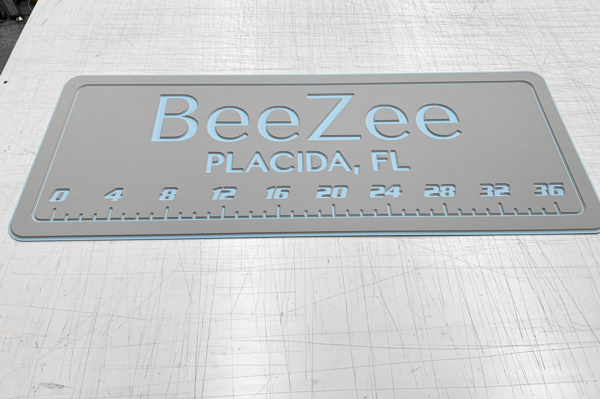 AquaGrip CT custom laser-engraved cooler pad BeeZee Placida FL — light gray over ice blue — 36 inch ruler flat lay shop photo