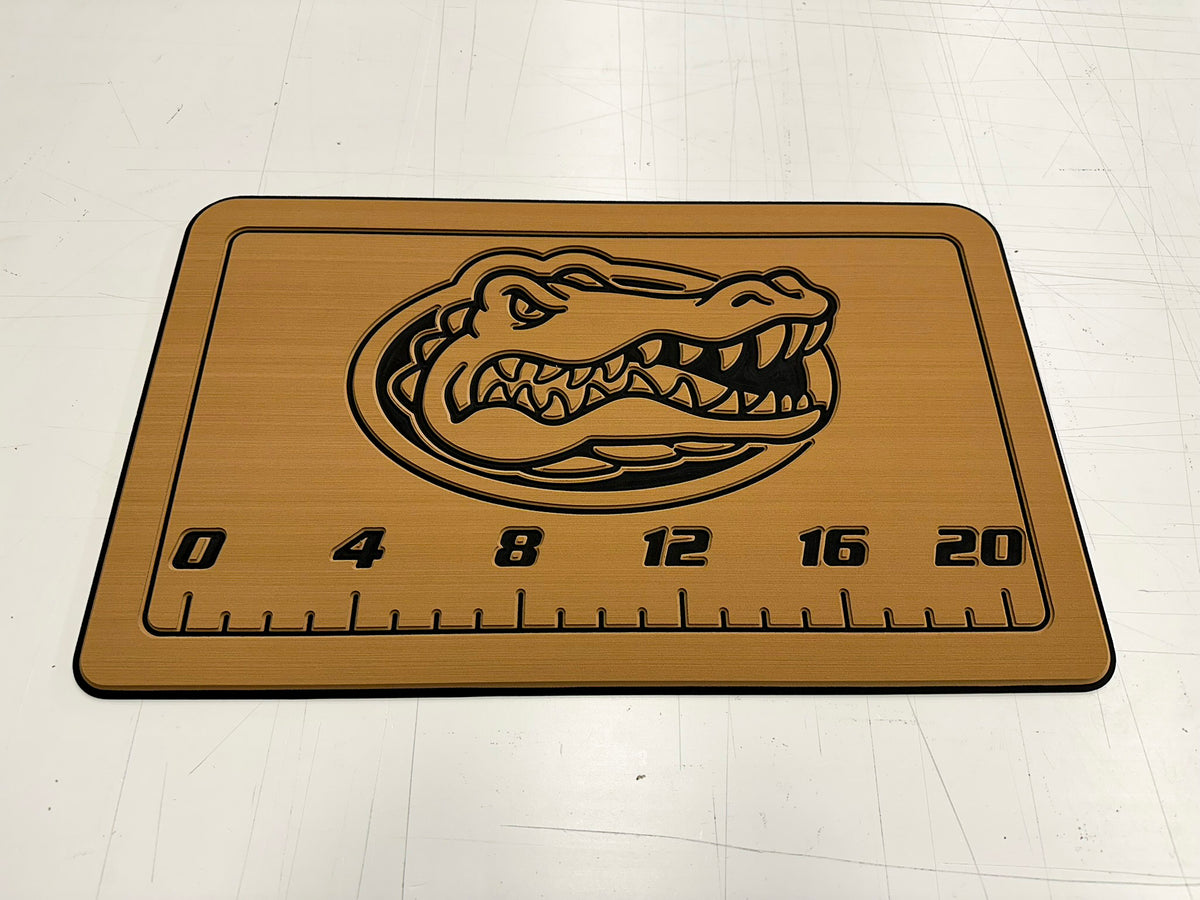 AquaGrip CT custom laser-engraved Florida Gators cooler pad with fish ruler — teak over black — flat lay shop photo