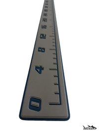 AquaGrip CT EVA foam fish ruler — medium gray over navy blue — angled studio shot close up