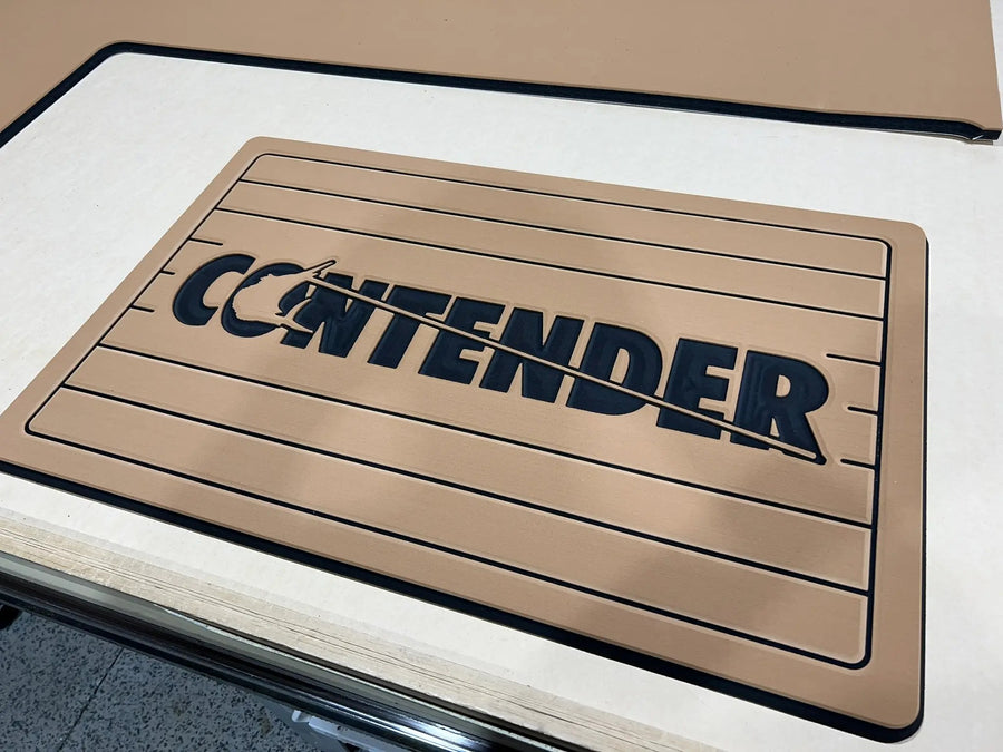 Custom AquaGrip helm pad engraved with the Contender logo, teak over black PE/EVA foam with teak lines