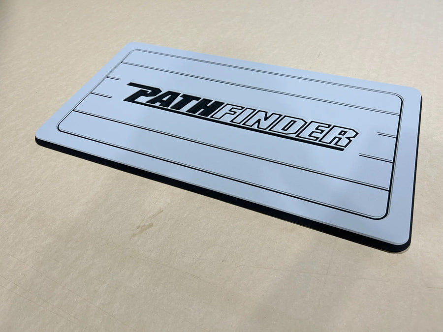 Custom AquaGrip helm pad engraved with the Pathfinder logo, light gray PE/EVA foam with teak lines