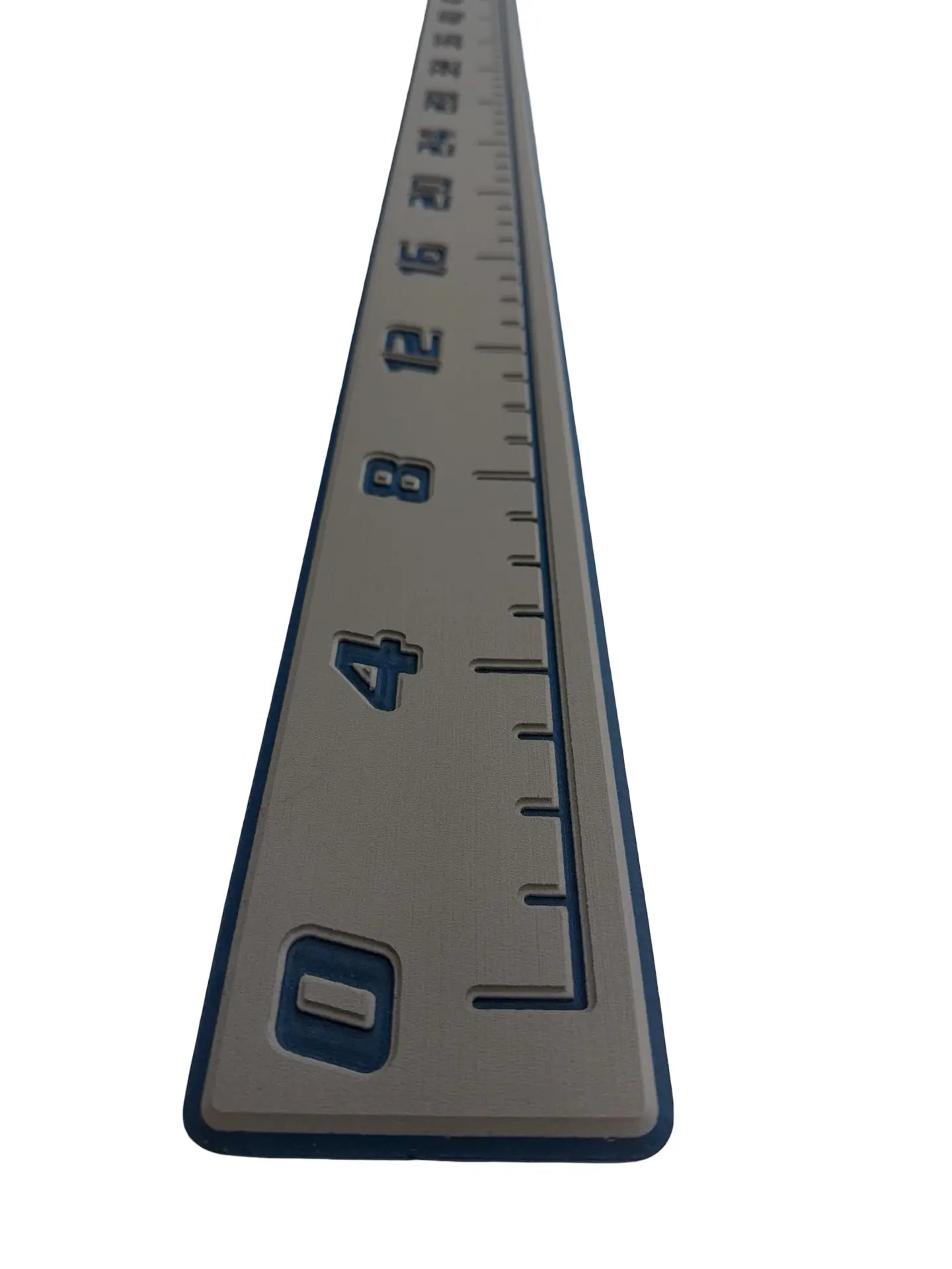 AquaGrip CT EVA foam fish ruler — medium gray over navy blue — angled studio shot close up