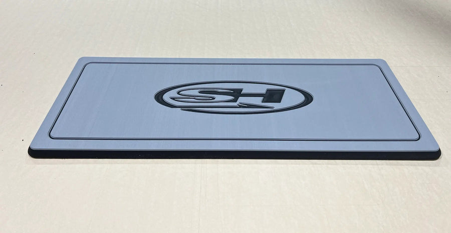 Custom AquaGrip helm pad engraved with the Sea Hunt logo, light gray over black PE/EVA foam