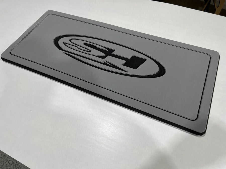 Custom AquaGrip helm pad engraved with the Sea Hunt logo, dark gray over black PE/EVA foam